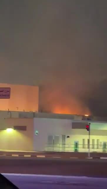 Smoke rises as a fire appears to be burning on the roof of one of the entrance buildings that are part of the U.S. Consulate in Dubai